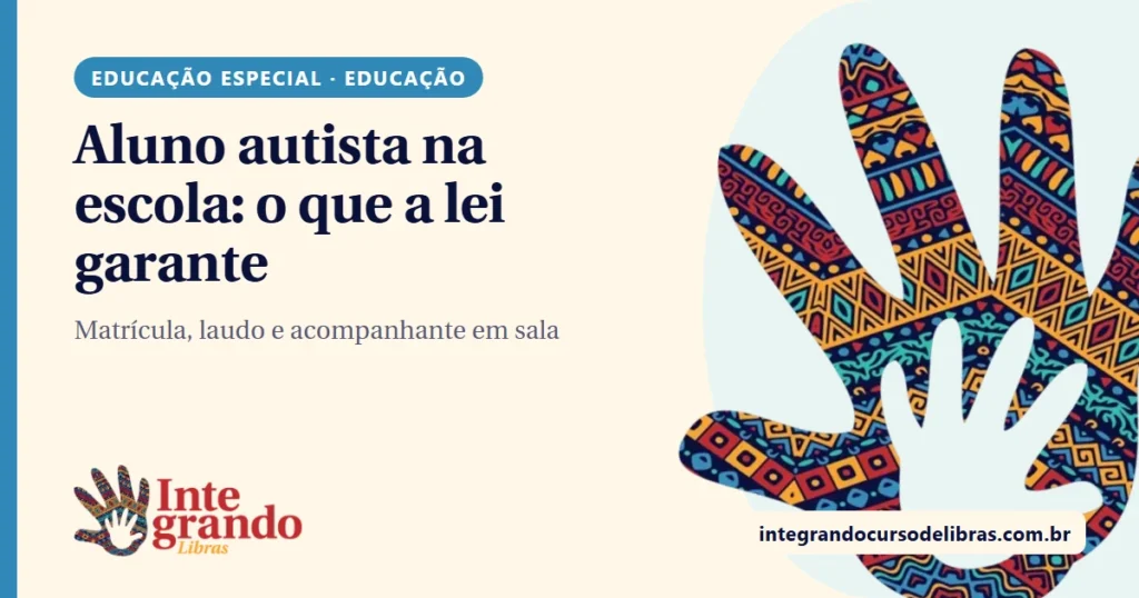 Capa em fundo creme com o título "Aluno autista na escola: o que a lei garante", chip azul "Educação especial · Educação", logo do Integrando Libras e uma mão grande com estampa afro colorida à direita.